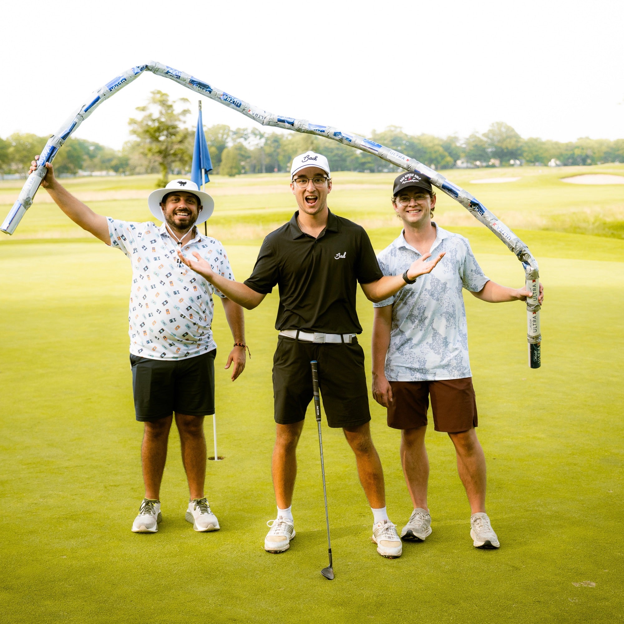 The Handshake Bets founders together at a golf event